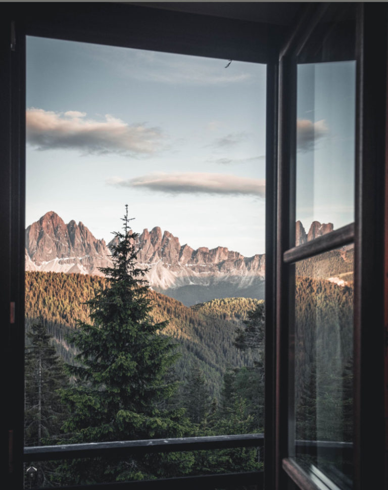 View from a window at the FORESTIS hotel over the Dolomites